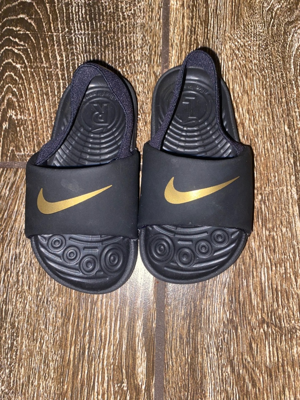 Nike Black Slip-On Sandal with Gold Logo Accent